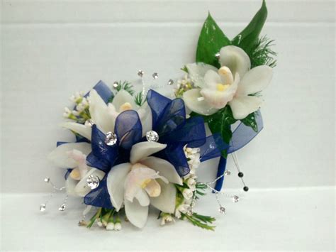 White mini cymbidium orchid corsage and boutonniere with blue and ...