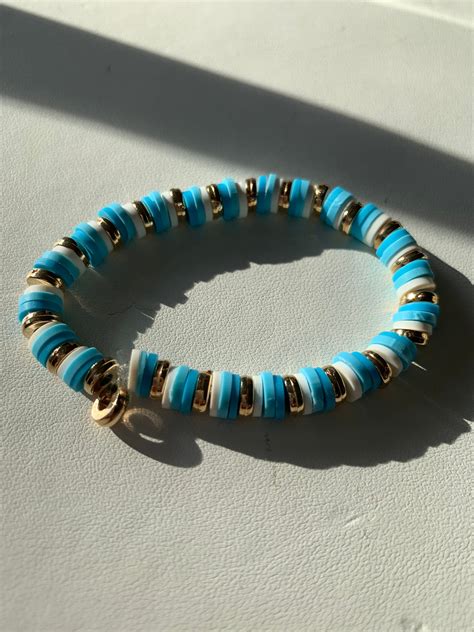 Trendy Blue white and gold clay bead bracelet | Etsy