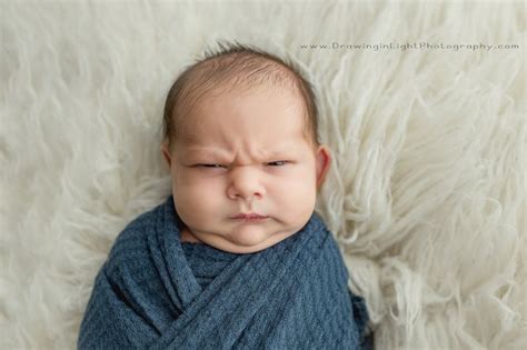 Meet the Grumpiest Newborn: Hilarious Photoshoot Takes the Internet by Storm