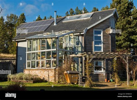 GLASS FRONTED HOUSE IN THE FINDHORN FOUNDATION ECOVILLAGE MORAY Stock Photo, Royalty Free Image ...