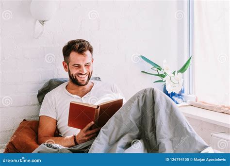 Young Man Reading a Book in the Bed Stock Image - Image of happy ...