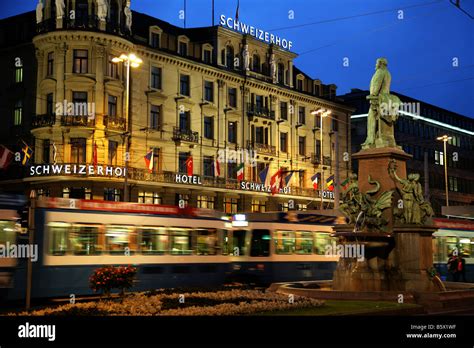 A tram passes the Hotel Schweizerhof opposite Zurich main train station ...