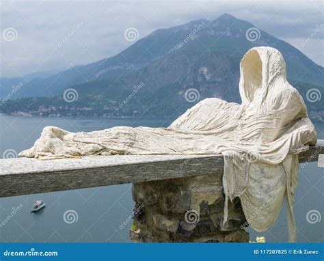 Hostly Statue Sitting on the Fence Above the Lake Editorial Image - Image of lake, cloak: 117207825