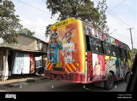 KENYA, Nairobi, Graffiti street art and traffic, colorful painted SACCO mini bus Matatu / KENIA ...