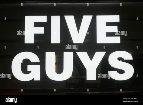 Milan, Italy - September 24, 2021: Five Guys logo displayed on a facade ...