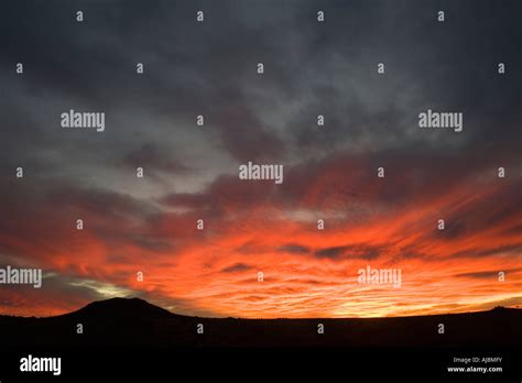 Sunset with Little Hill Silhouette & Sunset Backdrop Stock Photo - Alamy