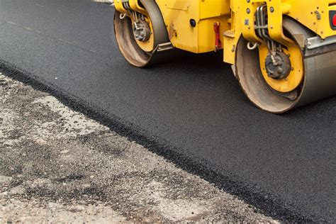 New asphalt road. Road asphalt works. Construction works. - Canadian ...