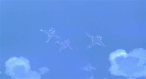 four airplanes flying in the blue sky with clouds