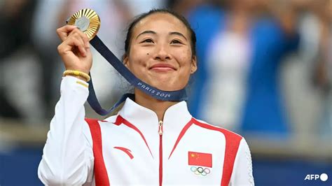 Tennis: Zheng Qinwen makes history with Olympic tennis singles gold ...