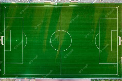 Premium Photo | Aerial view of a green field for playing football