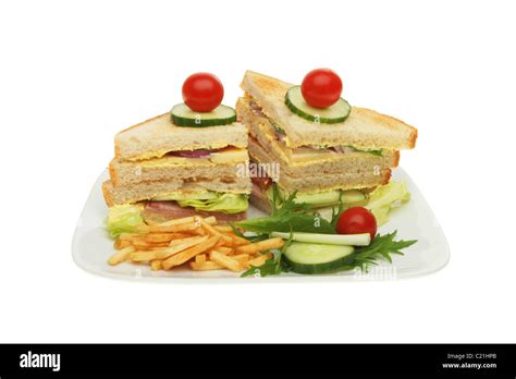 Club sandwich with salad garnish and potato chips Stock Photo - Alamy