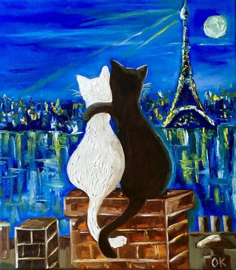 two black and white cats sitting on a ledge looking at the eiffel tower