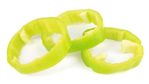 Premium Photo | Fresh green pepper slices isolated on white