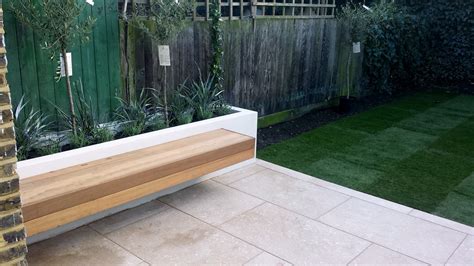 Grey limestone patio paving raised beds floating hardwood bench Clapham ...