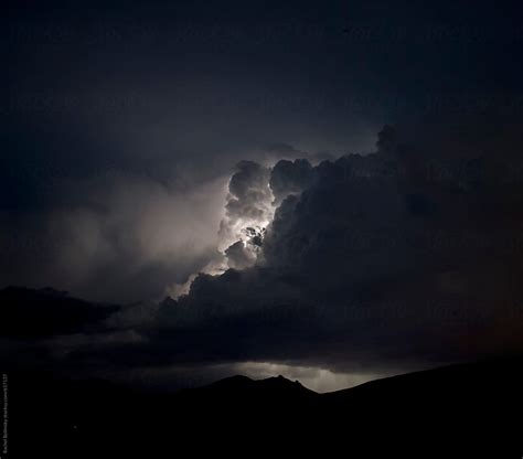 "Lightning Illuminates Clouds In A Stormy Night Sky" by Stocksy Contributor "Rachel Bellinsky ...