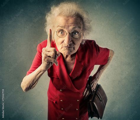 Angry grandma pointing out something foto de Stock | Adobe Stock