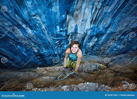 Rock Climber Climbing Up a Cliff Stock Photo - Image of lifestyle, cave: 52421942