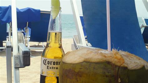 a good day on the beach at blue chairs, puerto vallarta | Puerto vallarta, Corona beer bottle ...