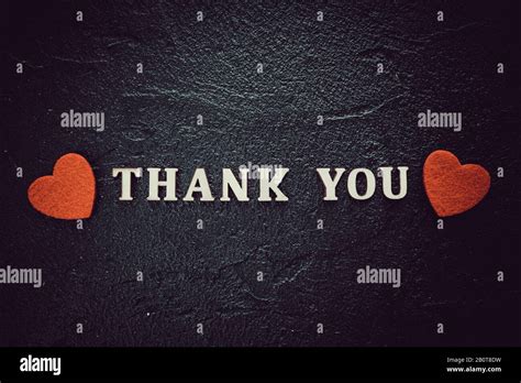 Thank you text on black background Stock Photo - Alamy