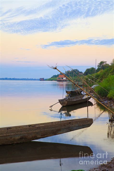 Fishing boats in the Mekong River Photograph by Sorapong Chaipanya - Fine Art America