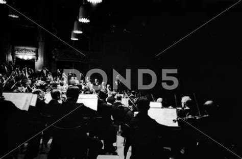 Photograph: A gloomy picture of Italian conductor Claudio Abbado conducting a rehearsal of L ...