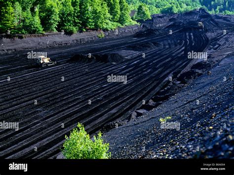 LARGE BULLDOZER MINING A 'DAM' OF ANTHRACITE (HARD) COAL (OPEN PIT OR STRIP MINE), SCHUYLKILL ...