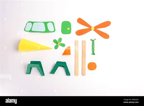 multi-colored paper parts to make a helicopter craft, activity for kids Stock Photo - Alamy