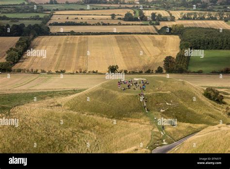 School children visiting Dragon Hill, White Horse Hill near Uffington, Oxfordshire, UK Stock ...