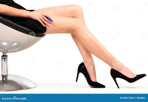 Woman with Long Legs Sitting in a Chair Stock Image - Image of background, footwear: 69921463