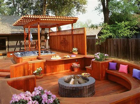 A round shaped deck design with a side wooden pergola shade over the hot tub seems wonderful as ...