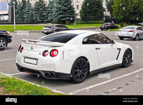 Kiev, Ukraine - September 2, 2017: Japanese supercar in the city. White Nissan GTR R35 Nissan on ...