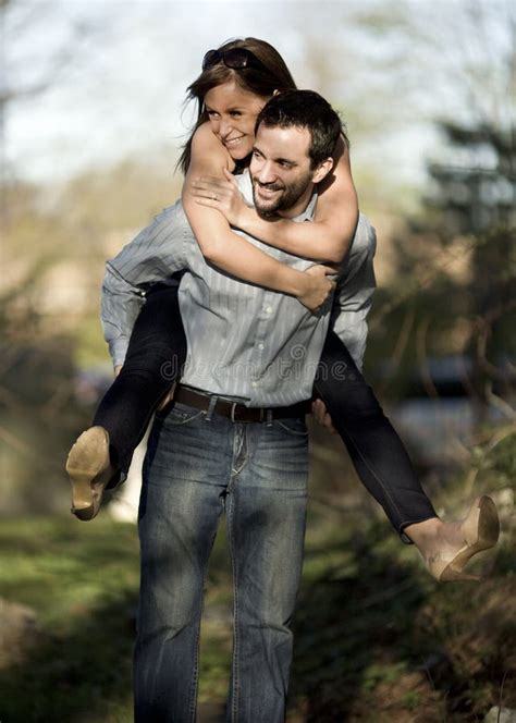 Piggyback Couple stock photo. Image of smiling, playing - 13935632