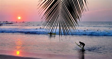 Surfing at Sunset on Playa Tamarindo, Costa Rica - Encircle Photos