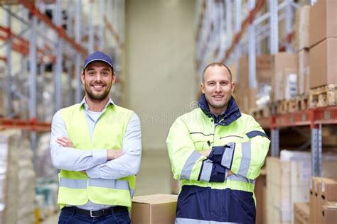 Men in Uniform with Boxes at Warehouse Stock Photo - Image of indoors, courier: 65710802