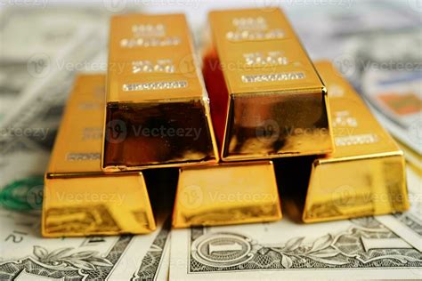 Gold bars on US dollar banknote money, finance trading investment ...