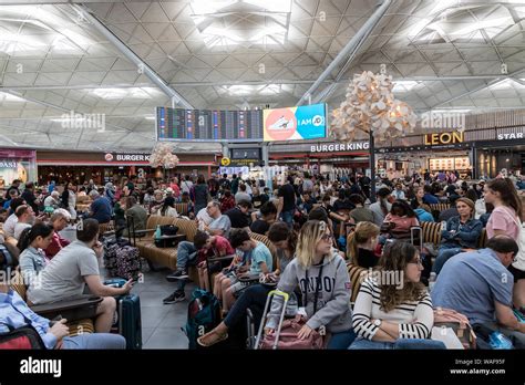 LONDON - AUGUST 7, 2019: Crowd of people at busy airport terminal at London Stansted Stock Photo ...