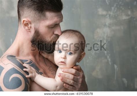 Handsome Tattooed Young Man Holding Cute Stock Photo 619130078 ...