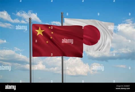 Japan flag and China flag waving together on blue sky, two country cooperation concept Stock ...