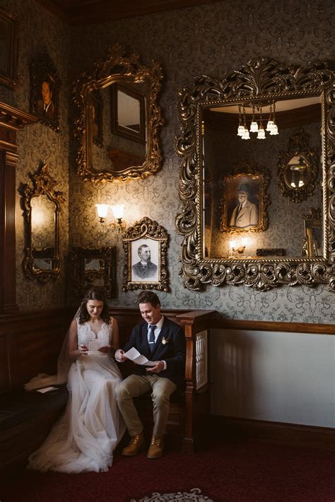 Bride and groom read private letters to each other at the Stanley Hotel in Estes Park. Classic ...