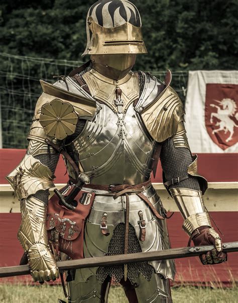 historic style high gothic suit of armour with gilded elements and leather covered sallet ...