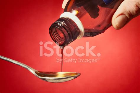 Pouring Some Cough Syrup Stock Photo | Royalty-Free | FreeImages