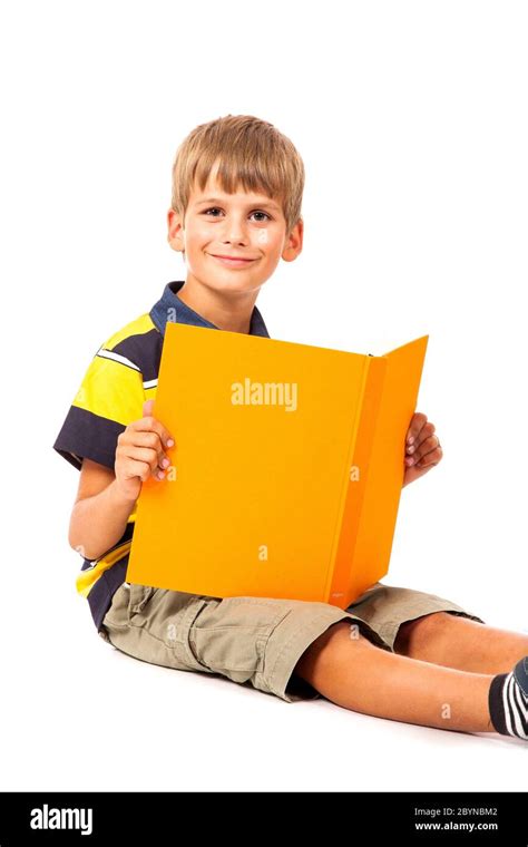 School boy is holding a book Stock Photo - Alamy