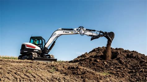 Largest compact excavator from Bobcat offers 66 horsepower, redesigned cab and available depth ...