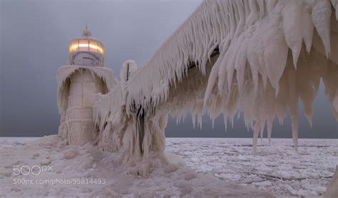 The lighthouse in St. Joseph, Michigan, covered in ice after the polar ...