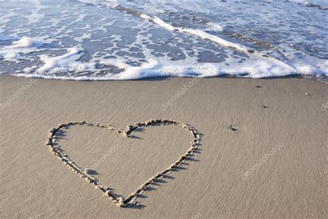 Heart in sand at beach Stock Photo by ©TunedIn61 88183662