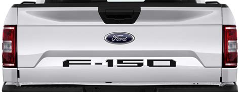 the back end of a white ford f - 150 pickup truck