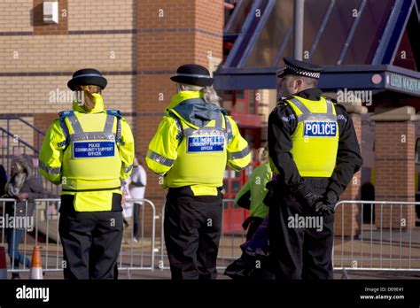 West Yorkshire Police officer standing with 2 Police Support Officer's standing opposite Leeds ...