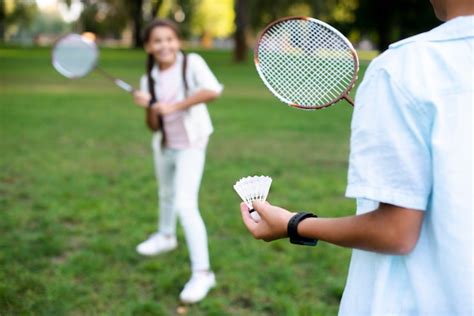 Free Photo | Kids playing badminton on beautiful summer day