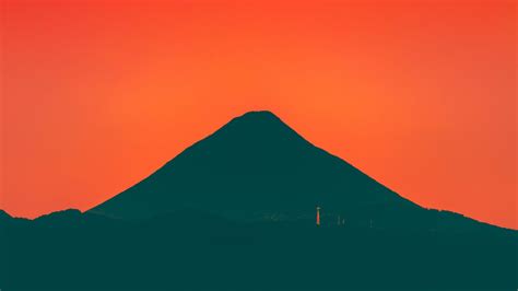 Silhouette of a Mountain during Sunset · Free Stock Photo