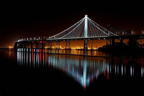 Illuminated Suspension Bridge Against Sky at Night · Free Stock Photo